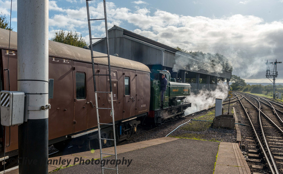 On hire from Tyseley is GWR 0-6-0PT no 7752. It is pulling the Quantock Belle dining train carriages out of the sidings.