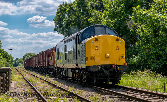 Having collected the goods train from Swithland 37714 approaches Quorn.