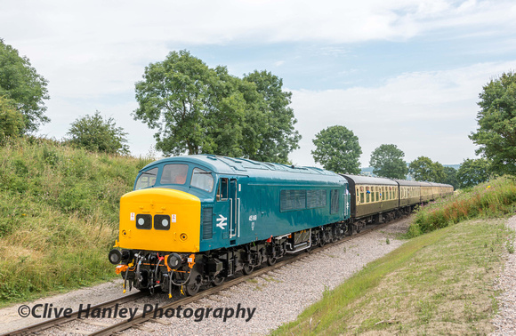 Newly restored to full operation is Class 45 "Peak" diesel no 45149. It is drifting downgrade towards Winchcombe