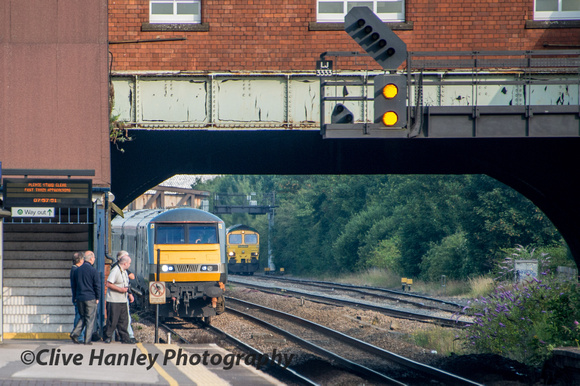 As 66502 drags a very slow moving freight liner (ex Ditton to Southampton) A Chiltern Mainline roars through.
