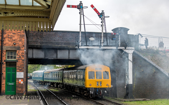 The DMU moves off with its characteristic smoky exhaust.