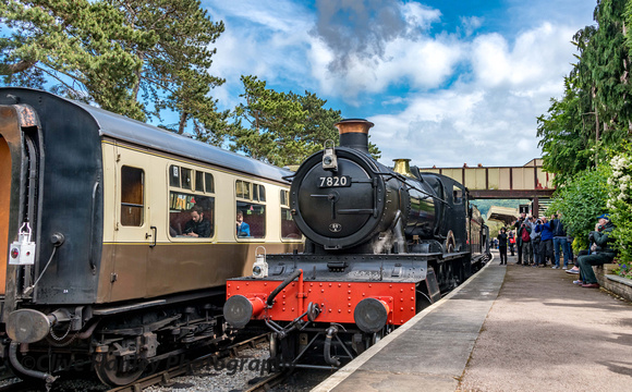 Departure of 7820 Dinmore Manor with the goods train