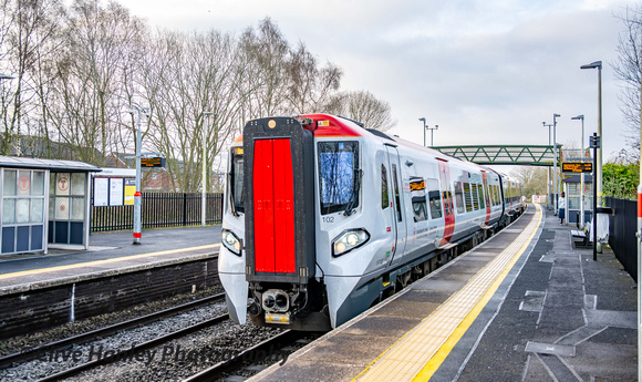 Unit 197102 on the 0435 from Cardiff to Manchester Piccadilly arrives at Whitchurch