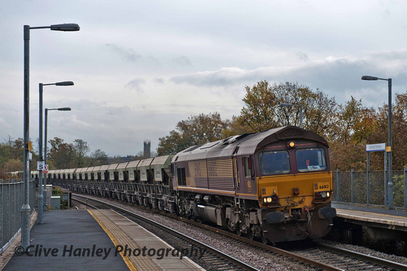 Class 66 no 66012 rumbles through Warwick Parkway with a northbound Lafarge freight.
