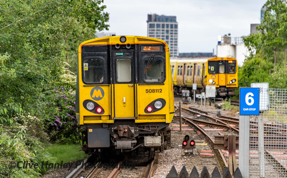 508112 departs Sandhills station while 508120 approaches from Liverpool.