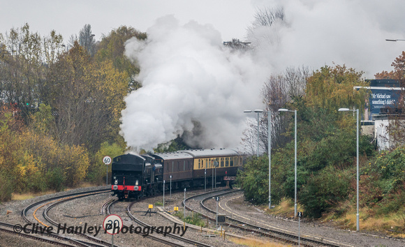 The steam excursion arrives 57 minutes late at Tyseley. It is rounding the curve from the North Warwickshire Line