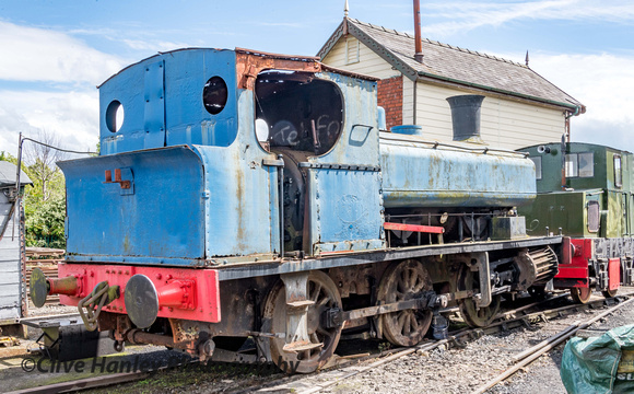 A steam loco sits in the yard awaiting overhaul.