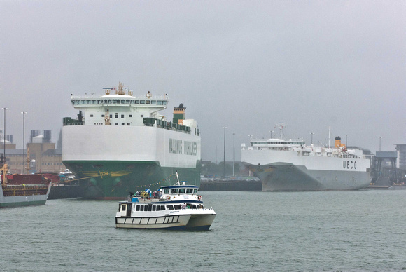 Two massive RO_RO ships. Closest operated by Wallenius Wilhelmsen while UECC operate the other.