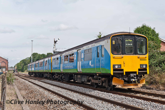 Unit 150003 in Network West Midlands livery departs Kidderminster