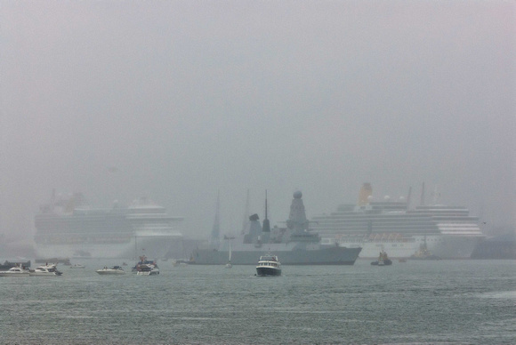 In the pouring rain HMS Dragon has slipped its moorings.