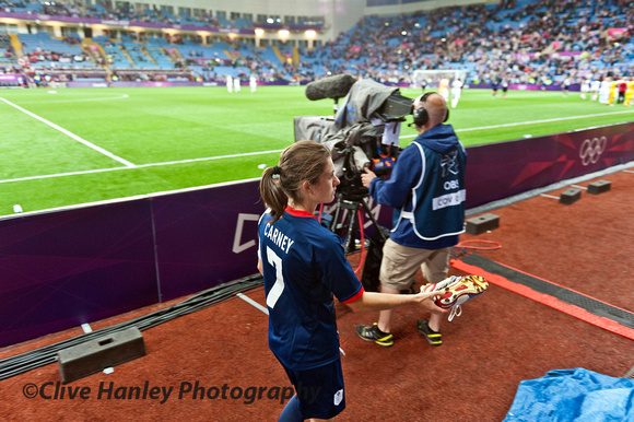 After the match GB player Karen Carney climbed over the fence and gave - yes GAVE her boots to a somewhat bewildered young girl.