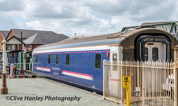 A Caledonian Sleeper carriage sits in the sidings.