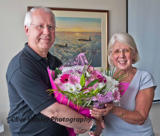 Ruth Powell, retiring Membership  Secretary for 655 MaPS receives a bouquet from the Chairman