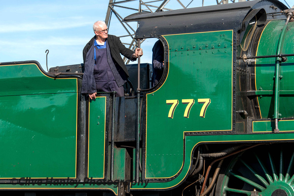 A portrait of Tom Tighe on the footplate of Sir Lamiel